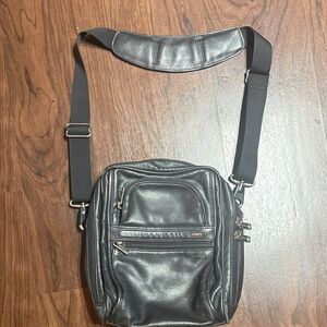 TUMI Black Leather Gender Neutral Small Travel Bag Purse Carry All